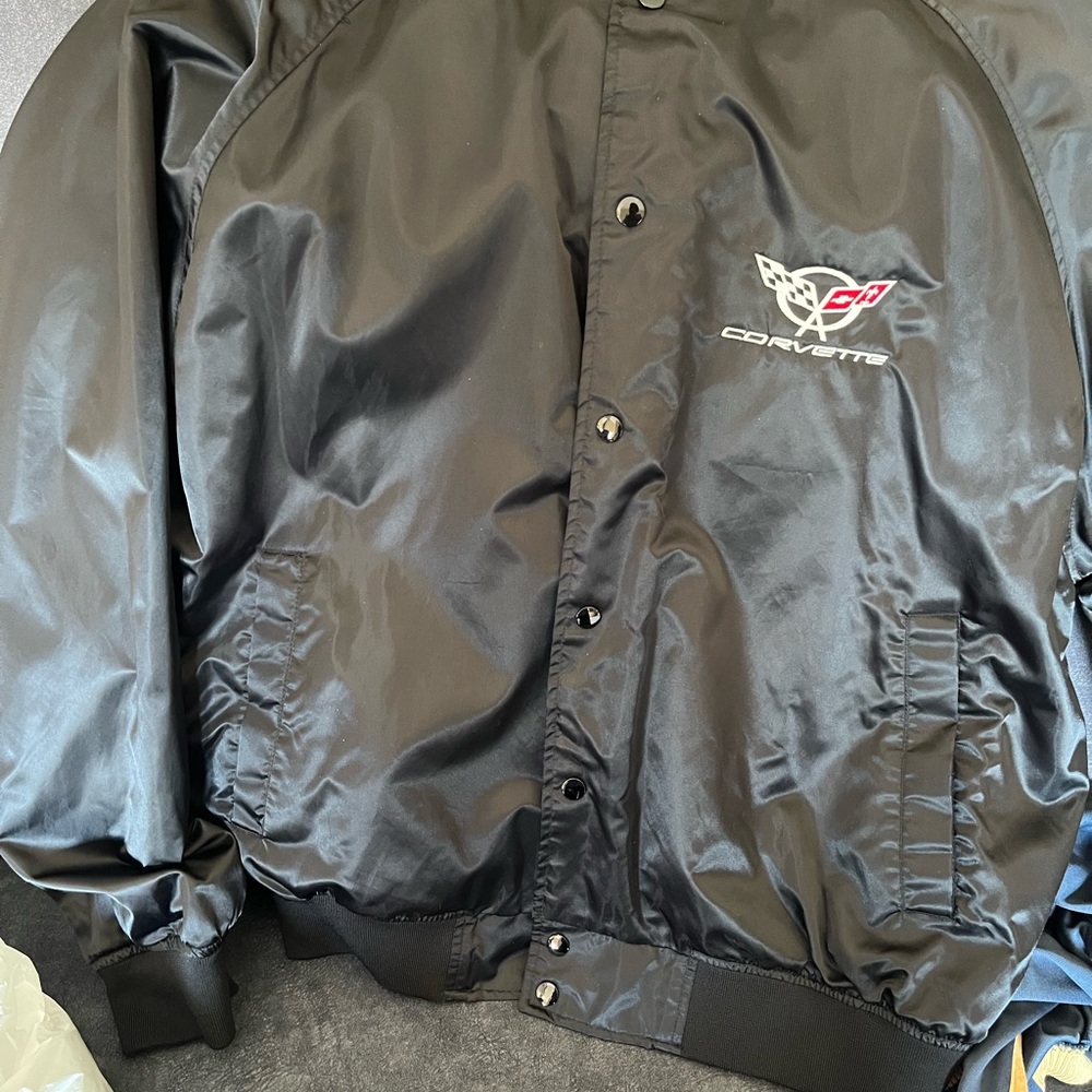 Sleek Black Bomber Jacket with Glossy Finish